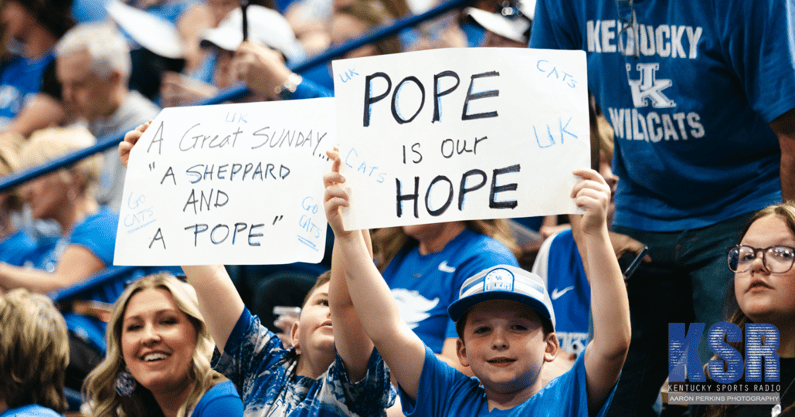 Kentucky fans hold up signs for Mark Pope at his introductory press conference - Aaron Perkins, Kentucky Sports Radio