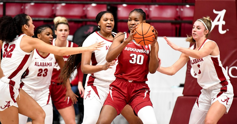 Arkansas forward Maryam Dauda (30) is surrounded by Alabama defenders after a rebound. (Photo by Gary Cosby Jr/Tuscaloosa News)