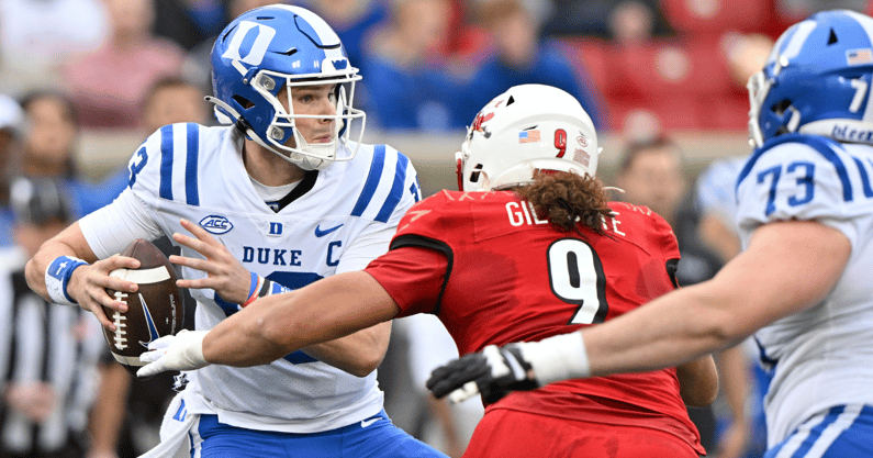 Louisville defensive lineman Ashton Gillotte (9) pressures former Duke quarterback Riley Leonard - © Jamie Rhodes-USA TODAY Sports