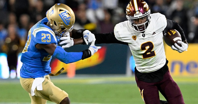 Nov 11, 2023; Pasadena, California, USA; Arizona State Sun Devils wide receiver Elijhah Badger (2) pushes away UCLA Bruins defensive back Kenny Churchwell III (23) after a catch during the second half at the Rose Bowl. Mandatory Credit: Alex Gallardo-USA TODAY Sports