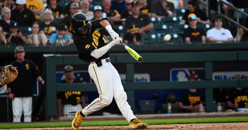 Cade Moss hits a home run against FIU on Friday. (Photo by Dennis Scheidt)
