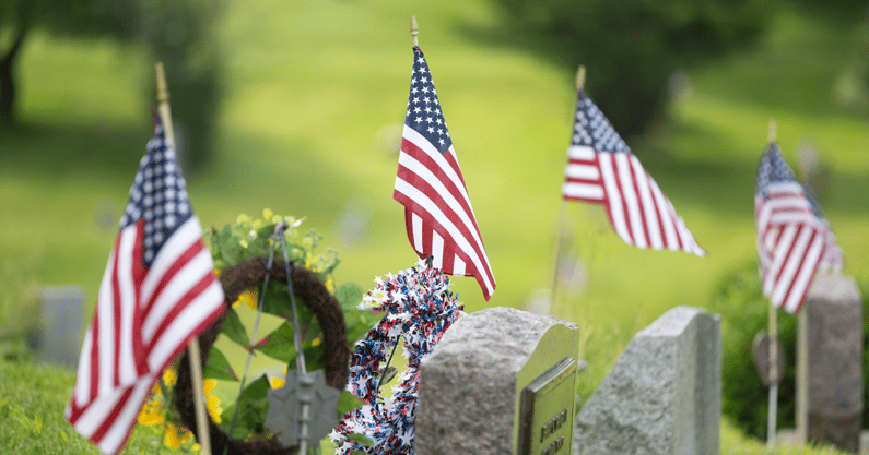 American flags mark the graves of United States military veterans Sunday, May 26, 2024, in Streetsboro’s Evergreen Cemetery - © Nicholas McLaughlin / USA TODAY NETWORK