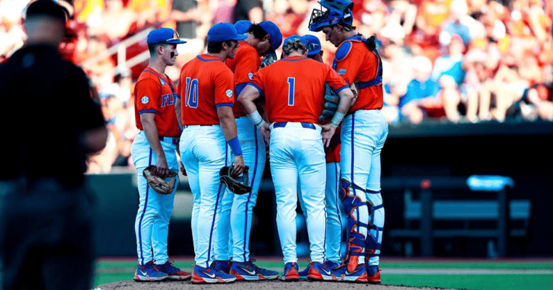 Untitled design (4Florida Gators mound meeting in the Stillwater Regional (photo courtesy of UAA Communications)0)