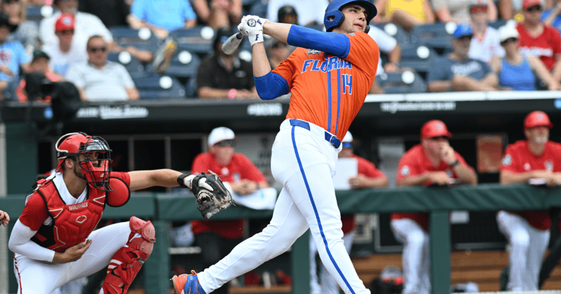 Jun 17, 2024; Omaha, NE, USA; Florida Gators starting pitcherdesignated hitter Jac Caglianone (14) hits a three run home run against the NC State Wolfpack during the second inning at Charles Schwab Field Omaha. Mandatory Credit: Steven Branscombe-USA TODAY Sports