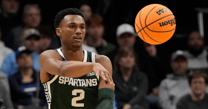 Michigan State Spartans guard Tyson Walker (2) passes the ball against the North Carolina Tar Heels in the second round of the 2024 NCAA Tournament at the Spectrum Center. - Bob Donnan, USA TODAY Sports
