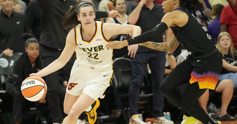 Indiana Fever guard Caitlin Clark (22) is guarded by Phoenix Mercury guard Sug Sutton (1) (Photo by Michael Chow-Arizona Republic)