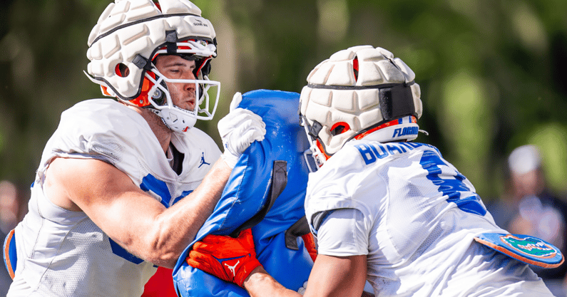 Florida Gators tight end Hayden Hansen (89) uses a tackling pad as fellow Gator Florida Gators tight end Arlis Boardingham (8) hits the pad during University of Florida Gators’ Spring football practice at Sanders Practice Fields in Gainesville, FL on Thursday, March 28, 2024. [Doug Engle/Gainesville Sun]