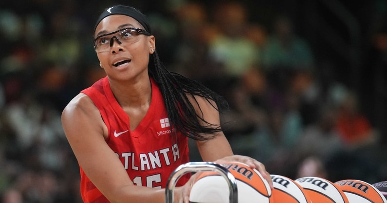 Former South Carolina women's basketball star and current Atlanta Dream guard Allisha Gray gathers a ball during last year's WNBA All-Star Game 3-point contest. (© Joe Rondone/The Republic / USA TODAY NETWORK)