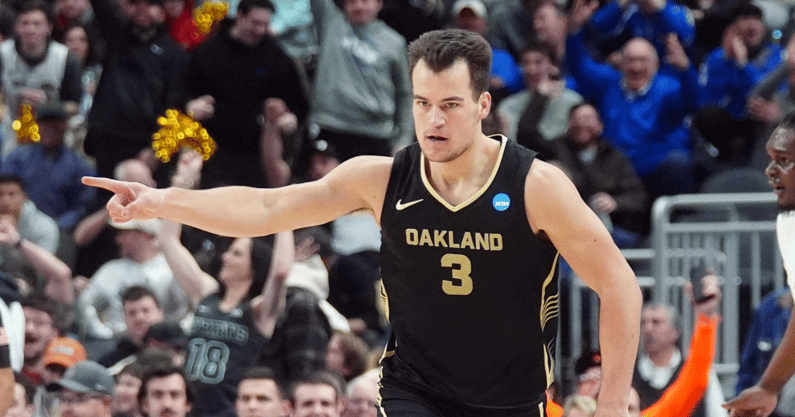Oakland Golden Grizzlies guard Jack Gohlke (3) celebrates after making a three point during the first half of the game against the North Carolina State Wolfpack in the second round of the 2024 NCAA Tournament at PPG Paints Arena - Gregory Fisher-USA TODAY Sports