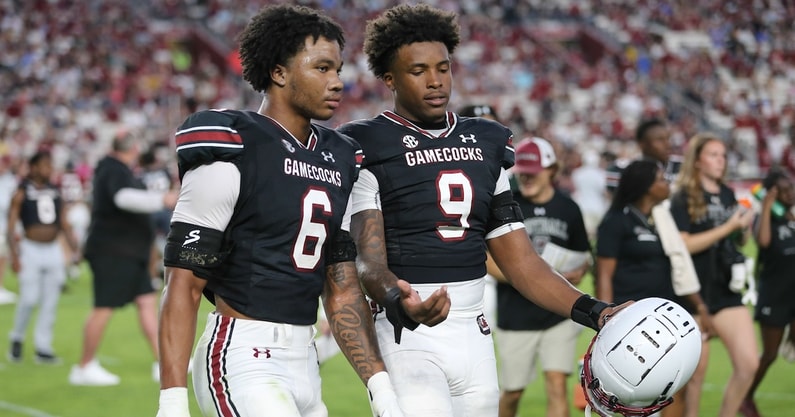 Gamecock football EDGEs Desmond Umeozulu and Dylan Stewart talk during the spring game in 2024 (Photo: CJ Driggers | GamecockCentral.com)