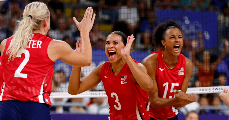Jul 31, 2024; Paris, France; United States outside hitter Avery Skinner (3) celebrates with setter Jordyn Poulter (2) after a play against Serbia in a pool A match during the Paris 2024 Olympic Summer Games at South Paris Arena 1. Mandatory Credit: Yukihito Taguchi-USA TODAY Sports