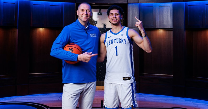 Koby Brea poses with Mark Pope in the Kentucky locker room