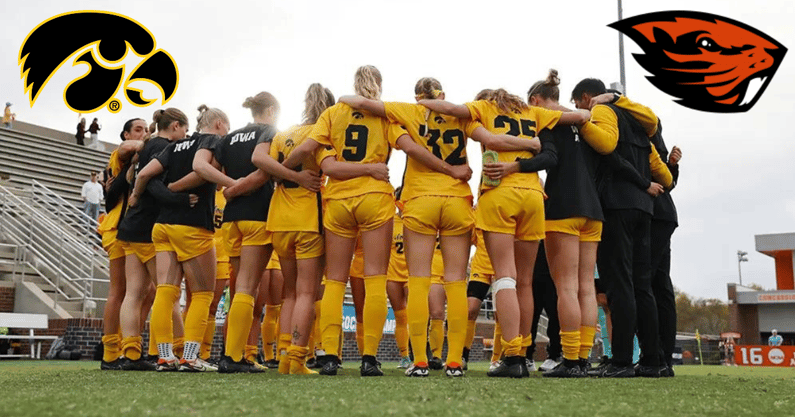 Iowa soccer huddles before a game against Georgia in the NCAA Tournament. (Photo by Stephen Mally/UI Athletics)