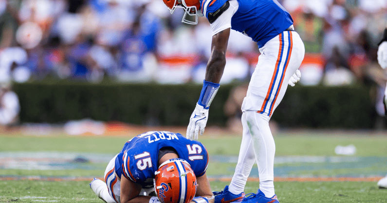 Aug 31, 2024; Gainesville, Florida, USA; Florida Gators wide receiver Elijhah Badger (6) stands over quarterback Graham Mertz (15) after Mertz suffers an apparent injury against the Miami Hurricanes during the second half at Ben Hill Griffin Stadium. Mandatory Credit: Matt Pendleton-USA TODAY Sports