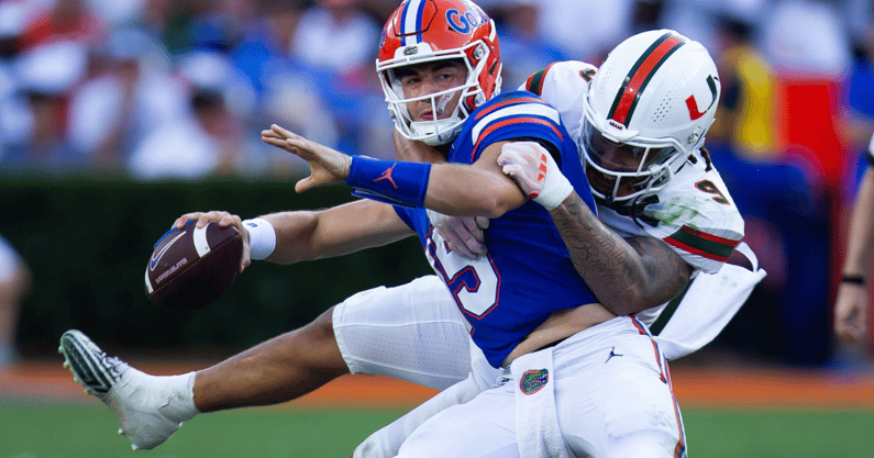 Miami Hurricanes defensive lineman Tyler Baron (9) sacks Florida Gators quarterback Graham Mertz (15) during the season opener at Ben Hill Griffin Stadium in Gainesville, FL on Saturday, August 31, 2024 against the University of Miami Hurricanes in the second half. Miami defeated the Gators 41-17. [Doug Engle/Gainesville Sun]