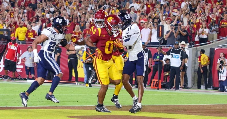 USC Trojans running back Quinten Joyner scores a touchdown against Utah State