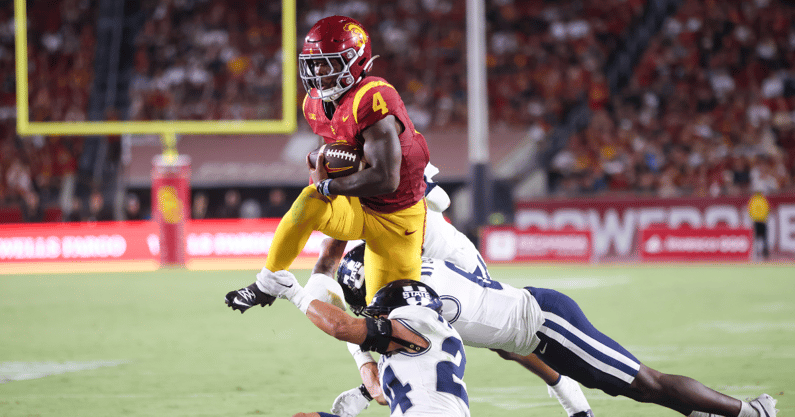 USC Trojans running back Woody Marks carries the ball against the Utah State Aggies
