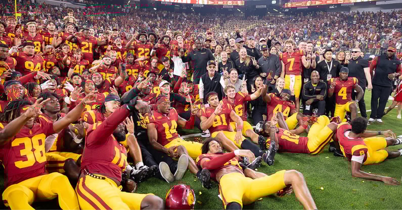 The USC Trojans pose for a team photo following a season-opening win against the LSU Tigers at Allegiant Stadium in Las Vegas