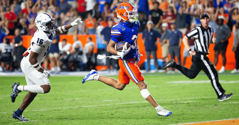 Florida Gators wide receiver Eugene Wilson III (3) runs for a touchdown as he looks back to Samford Bulldogs cornerback Kamron Smith (16) during the second half to make it 38-7 after the extra point at Ben Hill Griffin Stadium in Gainesville, FL on Saturday, September 7, 2024 against the Samford Bulldogs. The Florida Gators won 45-7 over the Bulldogs. [Doug Engle/Gainesville Sun]