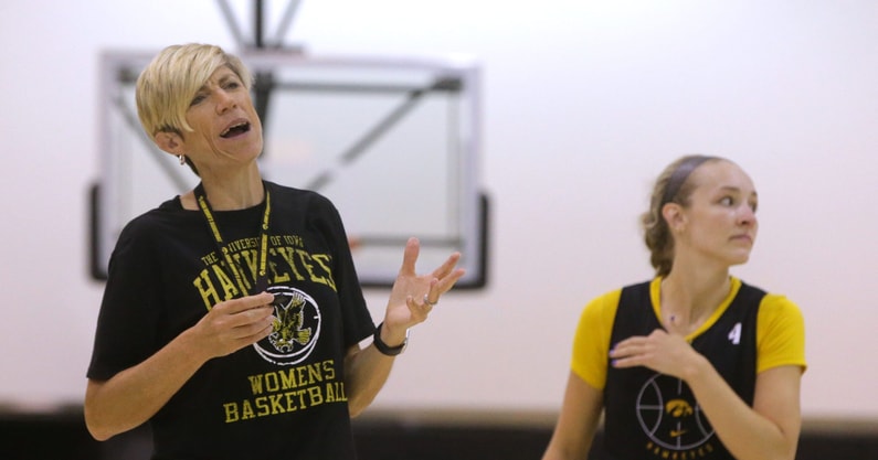 Head Coach Jan Jensen coaches her team during a practice. (Photo by Julia Hansen/Iowa City Press-Citizen)