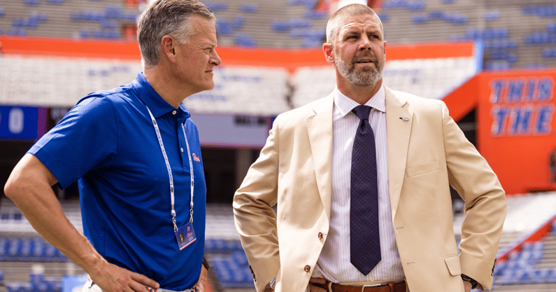 Sep 14, 2024; Gainesville, Florida, USA; Florida Gators athletic director Scott Stricklin (left) and head coach Billy Napier talk before a game against the Texas A&M Aggies at Ben Hill Griffin Stadium. Mandatory Credit: Matt Pendleton-Imagn Images