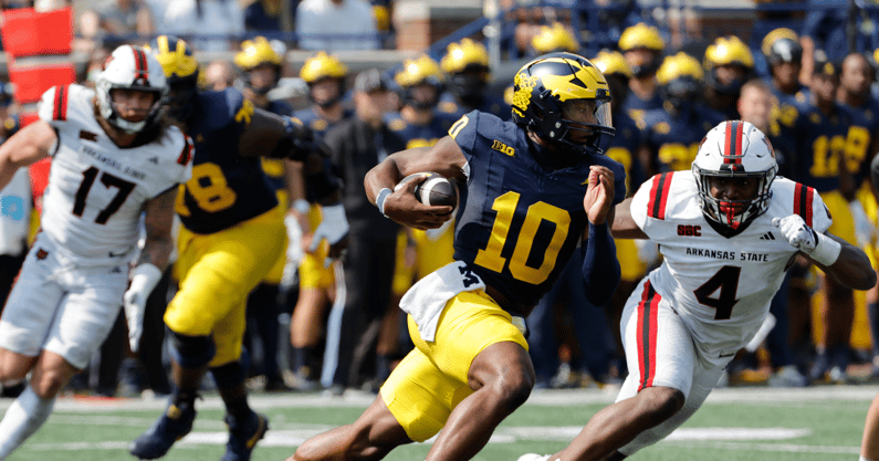 Michigan Wolverines football junior quarterback Alex Orji led a touchdown drive in a win over Arkansas State. (Photo by Rick Osentoski-Imagn Images)