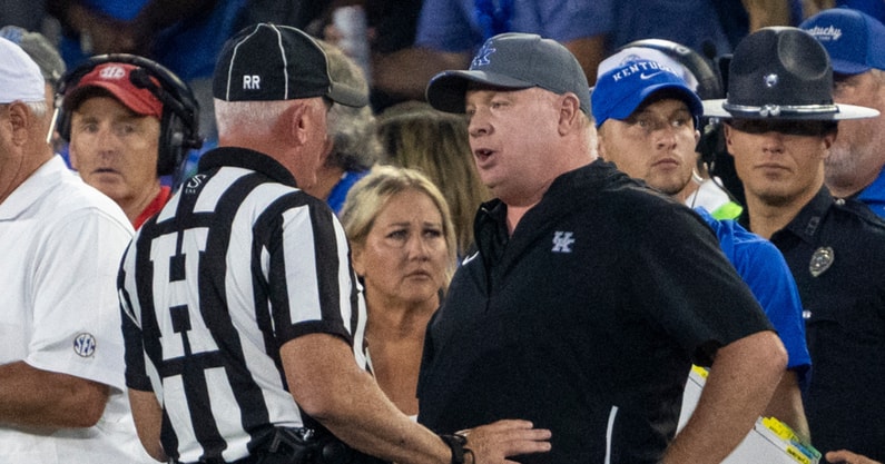 Kentucky Wildcats head coach Mark Stoops talks to a referee after a play against the Georgia Bulldogs at Kroger Field. Mandatory Credit: Tanner Pearson-Imagn Images