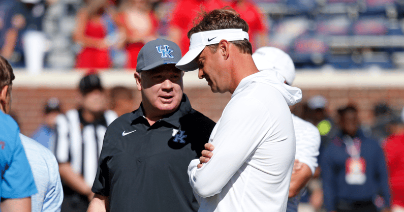 Kentucky Wildcats head coach Mark Stoops (left) and Mississippi Rebels head coach Lane Kiffin (right) talk prior tot the game at Vaught-Hemingway Stadium. Mandatory Credit: Petre Thomas-Imagn Images
