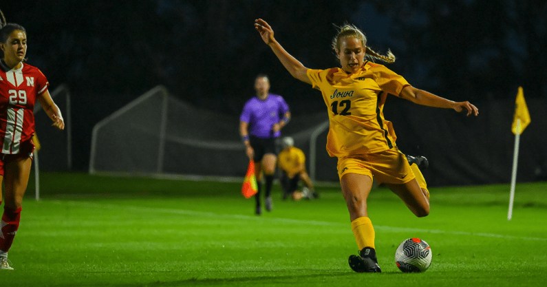 Iowa midfielder Lauren Geczik attempts a cross against Nebraska. (Photo by Dennis Scheidt)