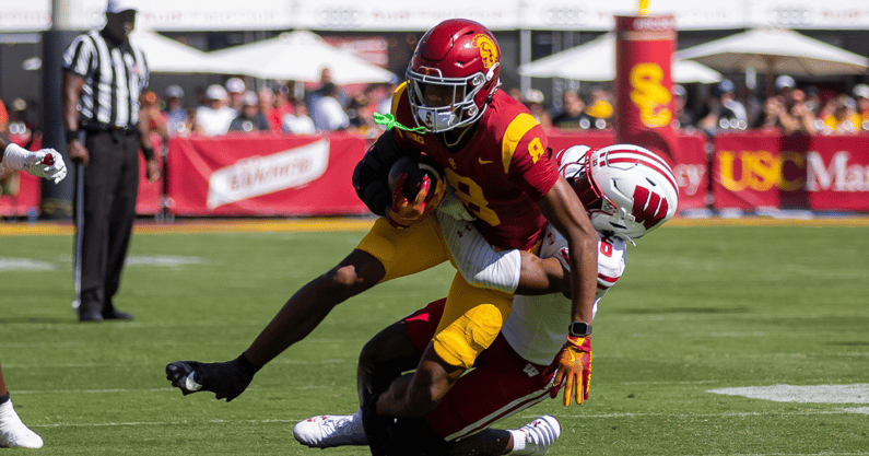 USC wide receiver Ja'Kobi Lane is tackled after making a catch during a game against the Wisconsin Badgers