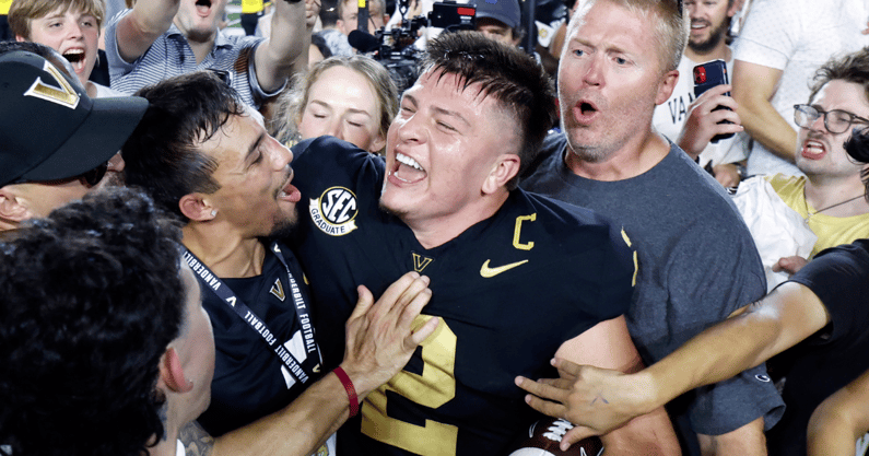 Vanderbilt Commodores quarterback Diego Pavia celebrates with fans after defeating the Alabama Crimson Tide at FirstBank Stadium. Mandatory Credit: Butch Dill-Imagn Images