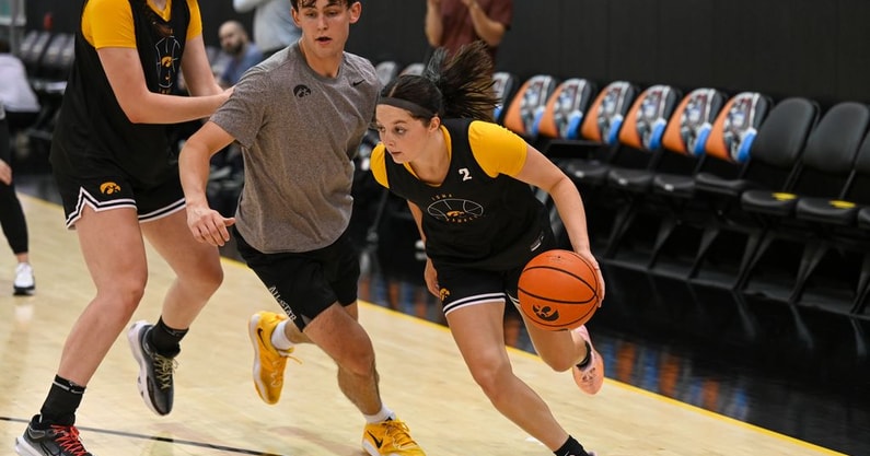 Iowa guard Taylor McCabe attacks the basket during a summer practice. (Photo by Dennis Scheidt)