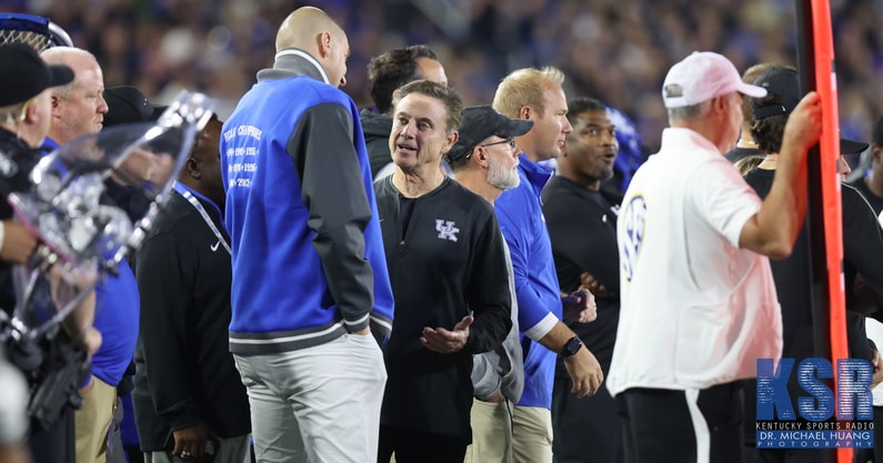 Mark Pope and Rick Pitino talk on the sideline at Kroger Field - Dr. Michael Huang, Kentucky Sports Radio