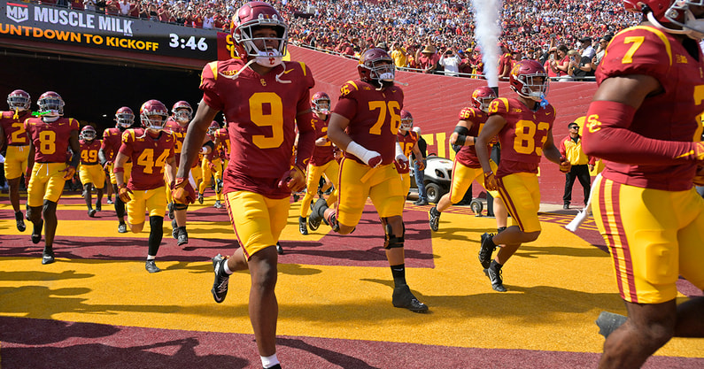 USC runs out of the tunnel against Penn State