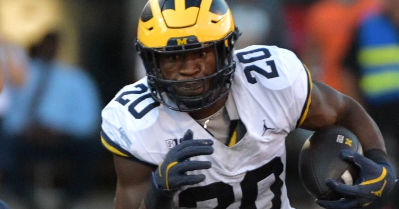 Oct 19, 2024; Champaign, Illinois, USA; Michigan Wolverines running back Kalel Mullings (20) runs the ball against the Illinois Fighting Illini during the second half at Memorial Stadium. Mandatory Credit: Ron Johnson-Imagn Images