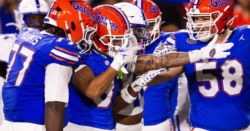 Florida Gators wide receiver Eugene Wilson III (3) signals a first down after hauling in a big pass play under Kentucky Wildcats defensive back JQ Hardaway (6) during the first half at Ben Hill Griffin Stadium in Gainesville, FL on Saturday, October 19, 2024 against the Kentucky Wildcats. [Doug Engle/Gainesville Sun]