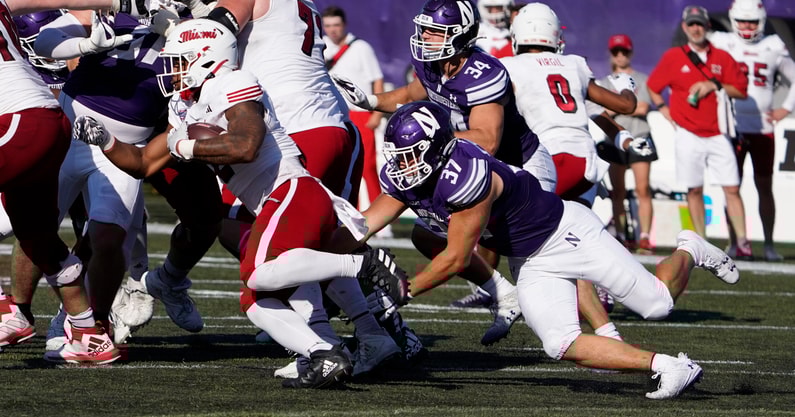 Northwestern linebacker Mac Uihlein tackles Miami (Oh) running back Dylan Downing. (Photo by David Banks-USA TODAY)