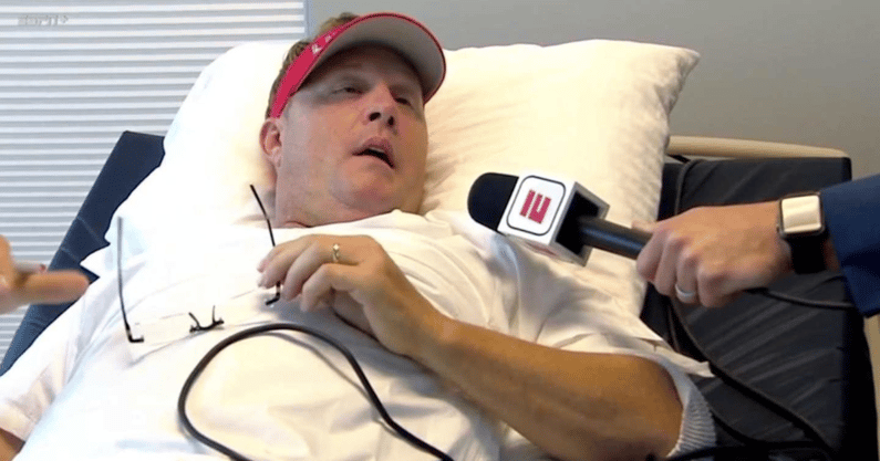 Hugh Freeze coaches from a hospital bed, screengrab via ESPN