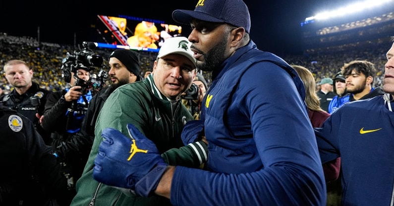 Michigan State head coach Jonathan Smith, left, shakes hands with head coach Sherrone Moore after 24-17 loss at Michigan Stadium in Ann Arbor on Saturday, Oct. 26, 2024. | Photo by Junfu Han | USA Today Network