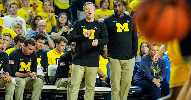 Michigan head coach Dusty May, center, and assistant coach Mike Boynton Jr. react to a play against Cleveland State during the second half at Crisler Center in Ann Arbor on Monday, Nov. 4, 2024. (Junfu Han/USA Today Syndication)
