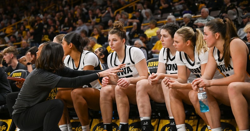 Iowa assistant coach Abby Stamp talks to her team in a game against MWSU. (Photo by Dennis Scheidt)