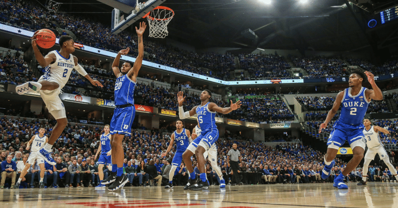 Kentucky G Jaxson Robinson makes a pass through traffic vs. Duke, via Matt Stone, Courier Journal, Imagn Images