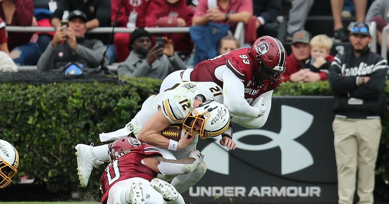 South Carolina defenders tackle a Missouri player in 2022 (Photo: CJ Driggers | GamecockCentral.com)