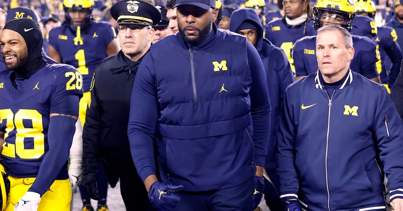 Nov 23, 2024; Ann Arbor, Michigan, USA;  Michigan Wolverines head coach Sherrone Moore walks off the field after a game against the Northwestern Wildcats at Michigan Stadium. Mandatory Credit: Rick Osentoski-Imagn Images