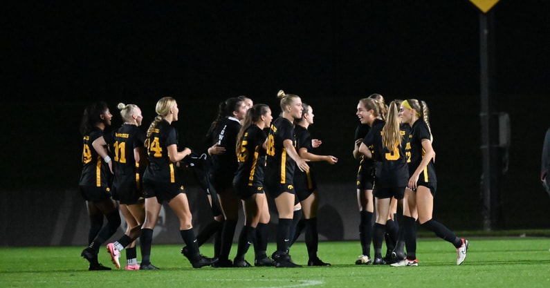 The Iowa soccer team reacts to beating Penn State. (Photo by Dennis Scheidt)