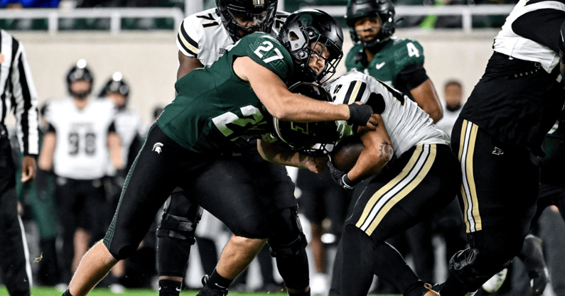 Michigan State's Cal Haladay, left, tackles Purdue's Devin Mockobee during the first quarter on Friday, Nov. 22, 2024, at Spartan Stadium in East Lansing - Nick King, USA TODAY Sports