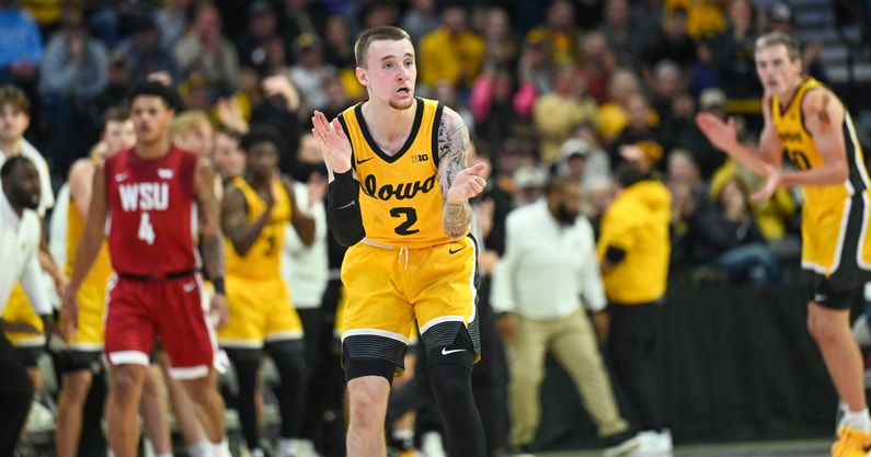 Iowa guard Brock Harding reacts to an Iowa made basket. (Photo by Dennis Scheidt)