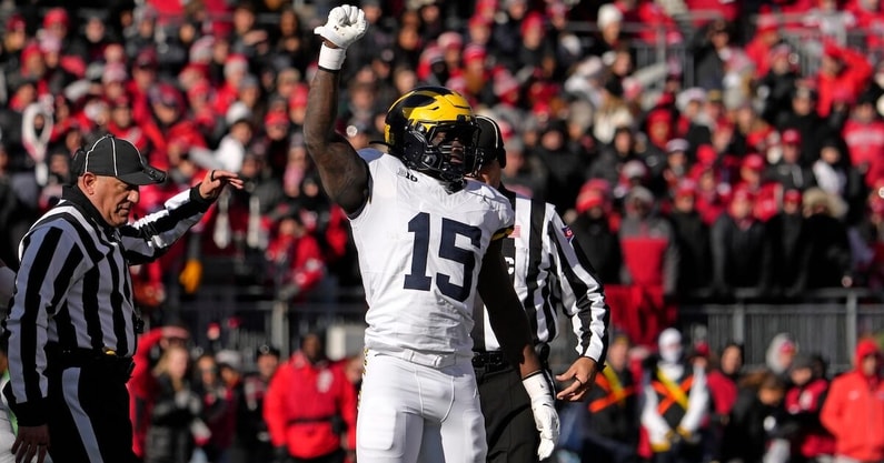Michigan Wolverines linebacker Ernest Hausmann (15) celebrates after tackling Ohio State Buckeyes quarterback Will Howard (18) during the first half of Saturday’s NCAA Division I football game at Ohio Stadium.