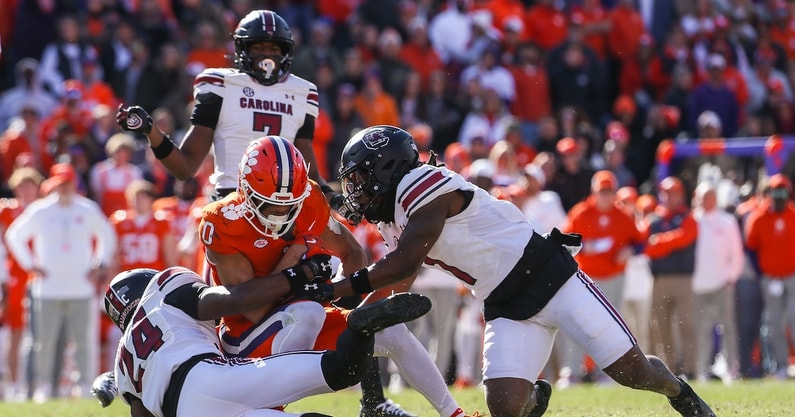 South Carolina defenders tackle a Clemson player in the 2024 game (Photo: Katie Dugan | GamecockCentral.com)