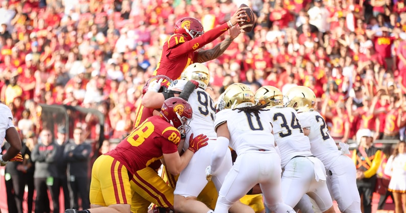 USC quarterback Jayden Maiava reaches the ball over the Notre Dame defensive line for a touchdown against the Fighting Irish